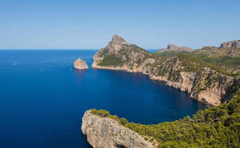 Explore the breathtaking cliffs and azure waters of Mallorca's coastline from an aerial perspective.